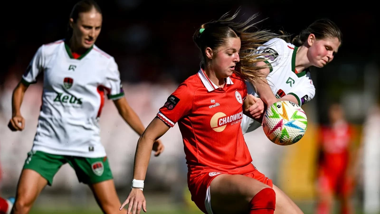 Two players contesting for the ball during match