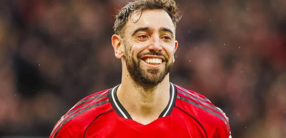 Football player smiling in Manchester United jersey