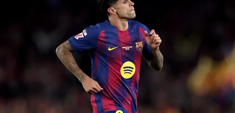 Player in FC Barcelona kit running on the pitch