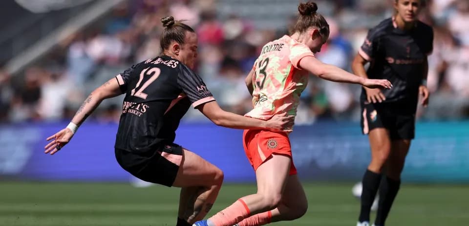 Portland Thorns player tackles Utah Royals opponent