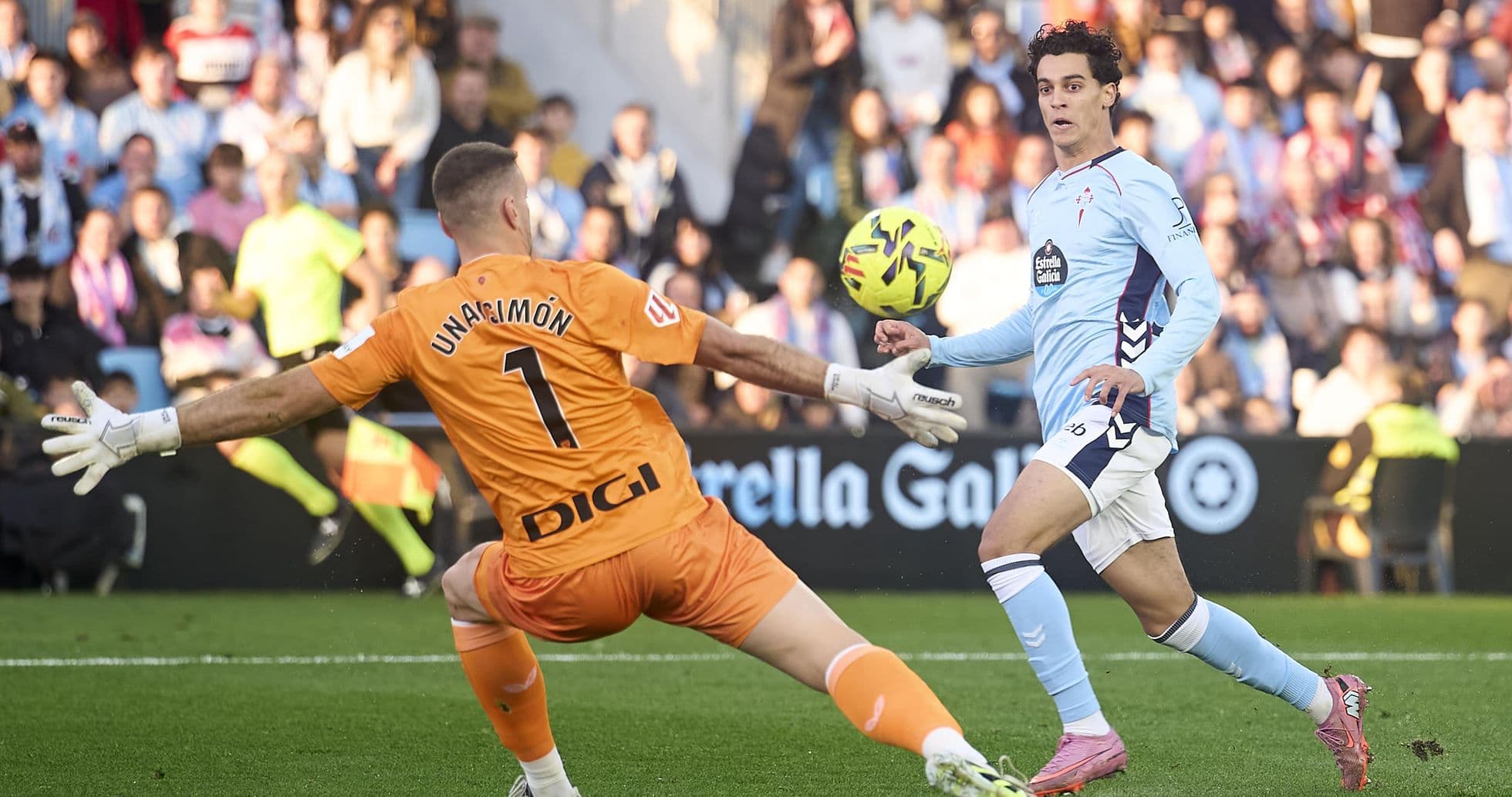 Goalkeeper attempting to block shot during match