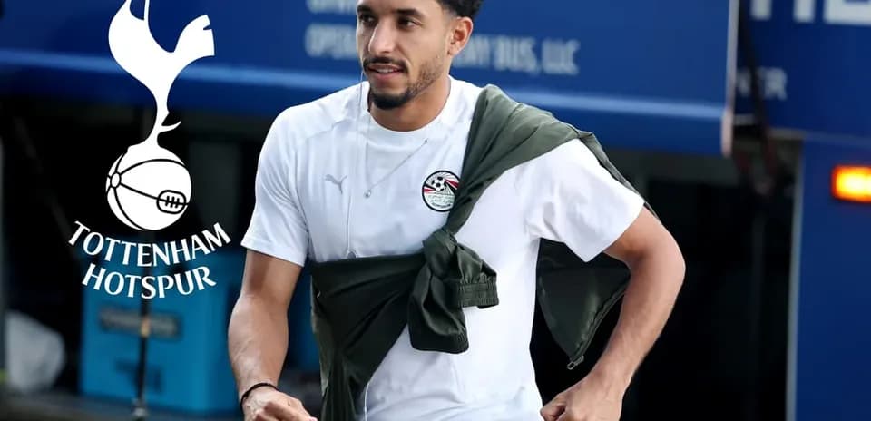 Player walking towards team bus at training ground