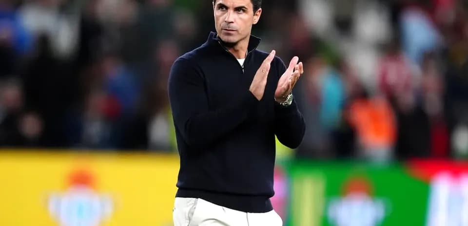 Coach applauding during a match at the stadium