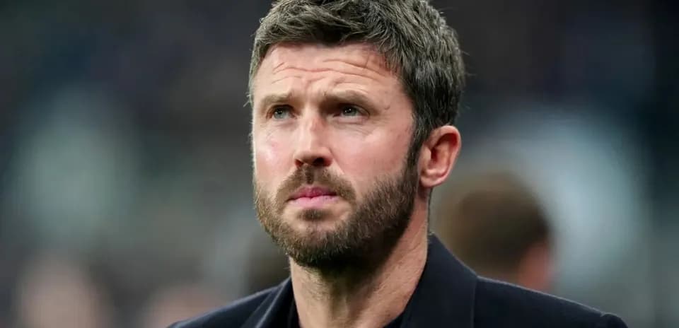 Man with beard looking thoughtfully off-camera