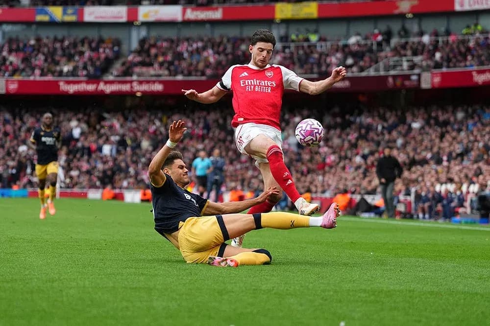 Player sliding tackle during West Ham vs Arsenal match
