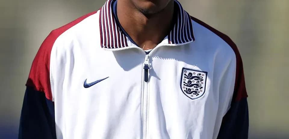 Player in England training jacket standing outdoors