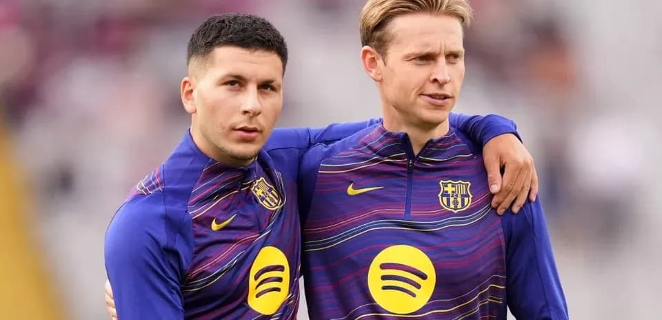 Two players in FC Barcelona training attire posing together