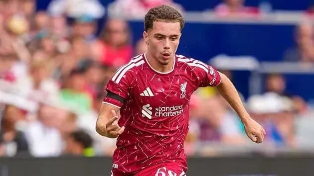 Liverpool player sprinting during a match
