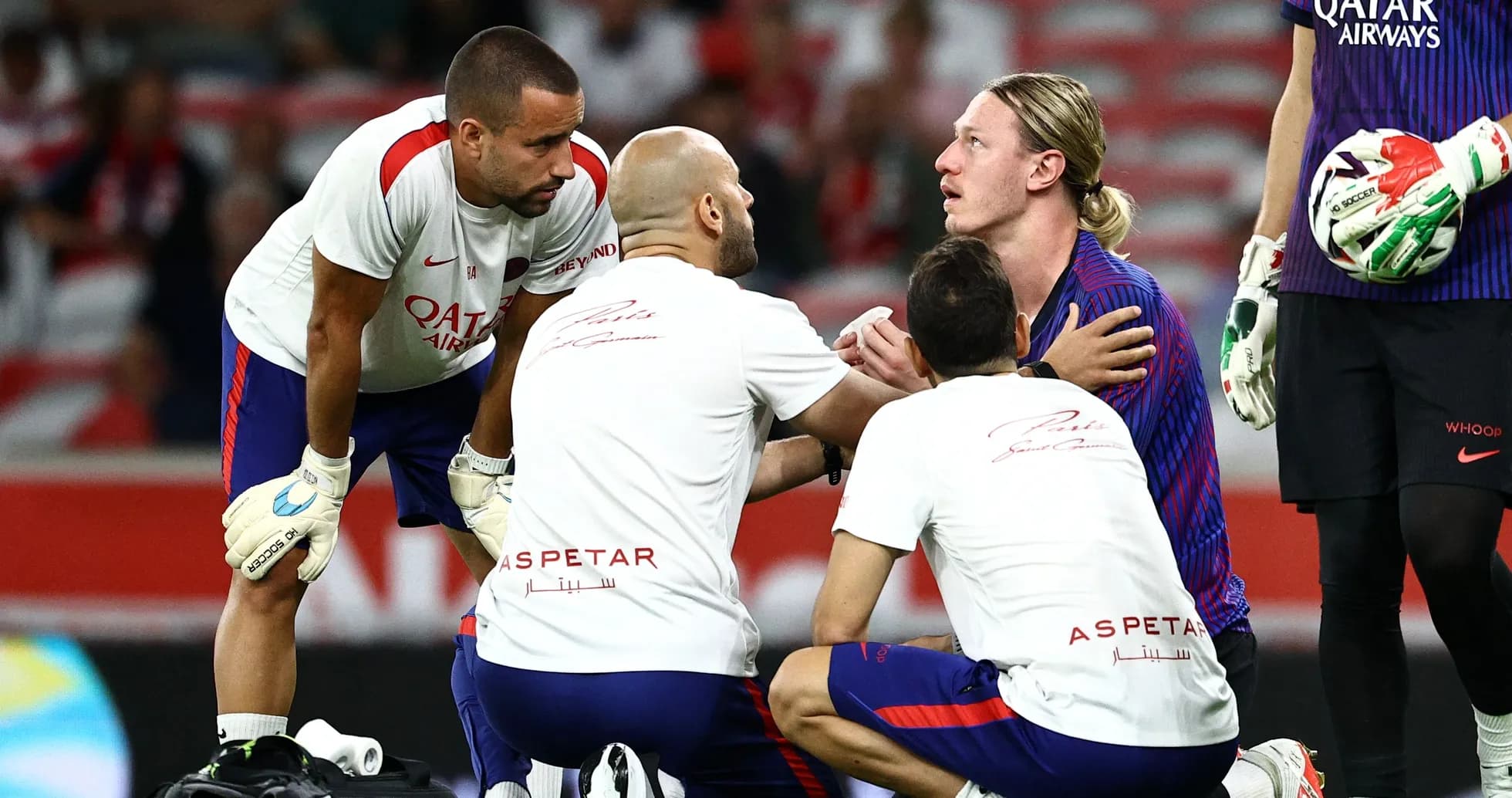 Medical staff attending to injured player on field