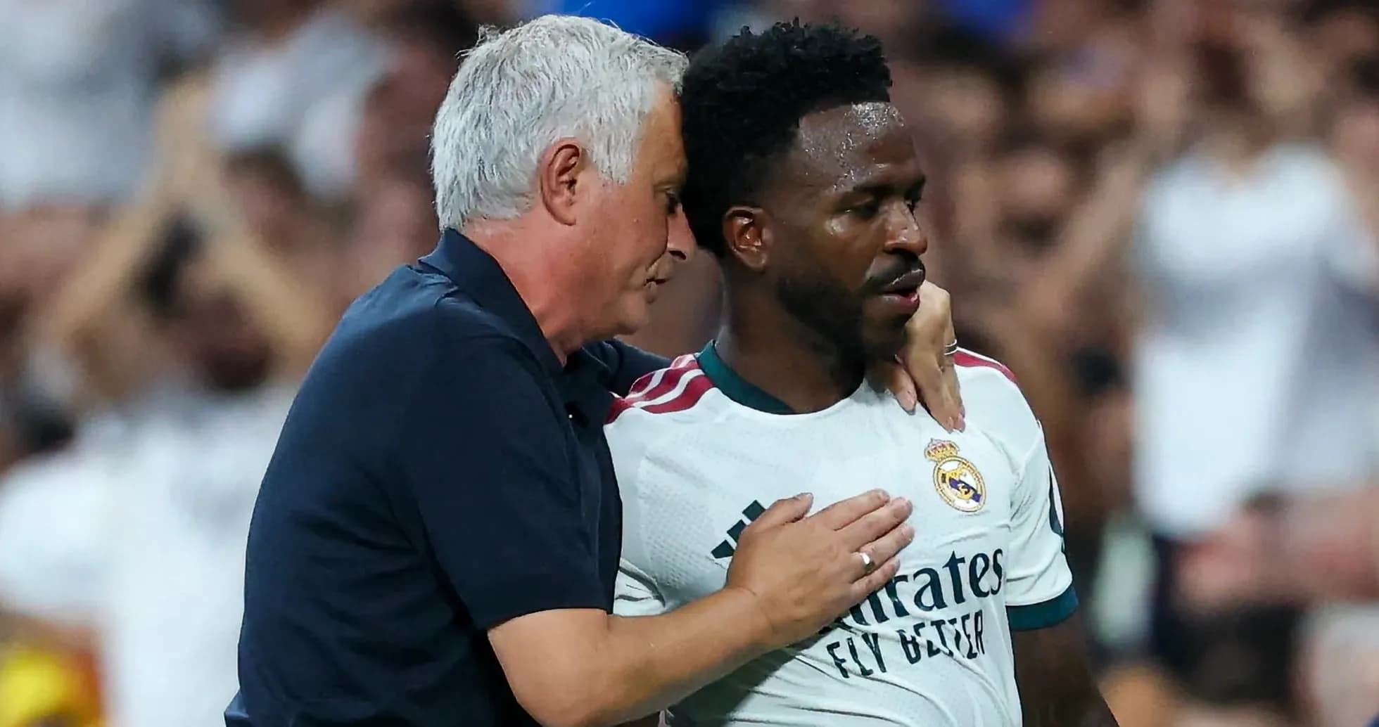 Coach speaking to player during match moment