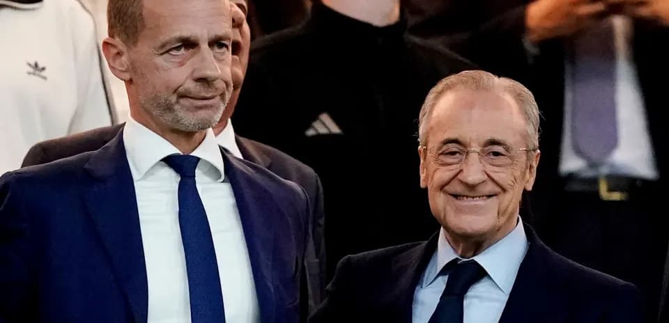 Two executives posing together at an event