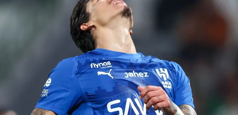Player in blue jersey reacting during match