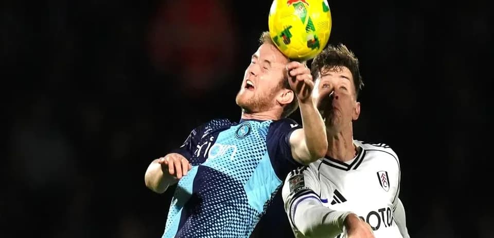 Two players competing for the ball in mid-air