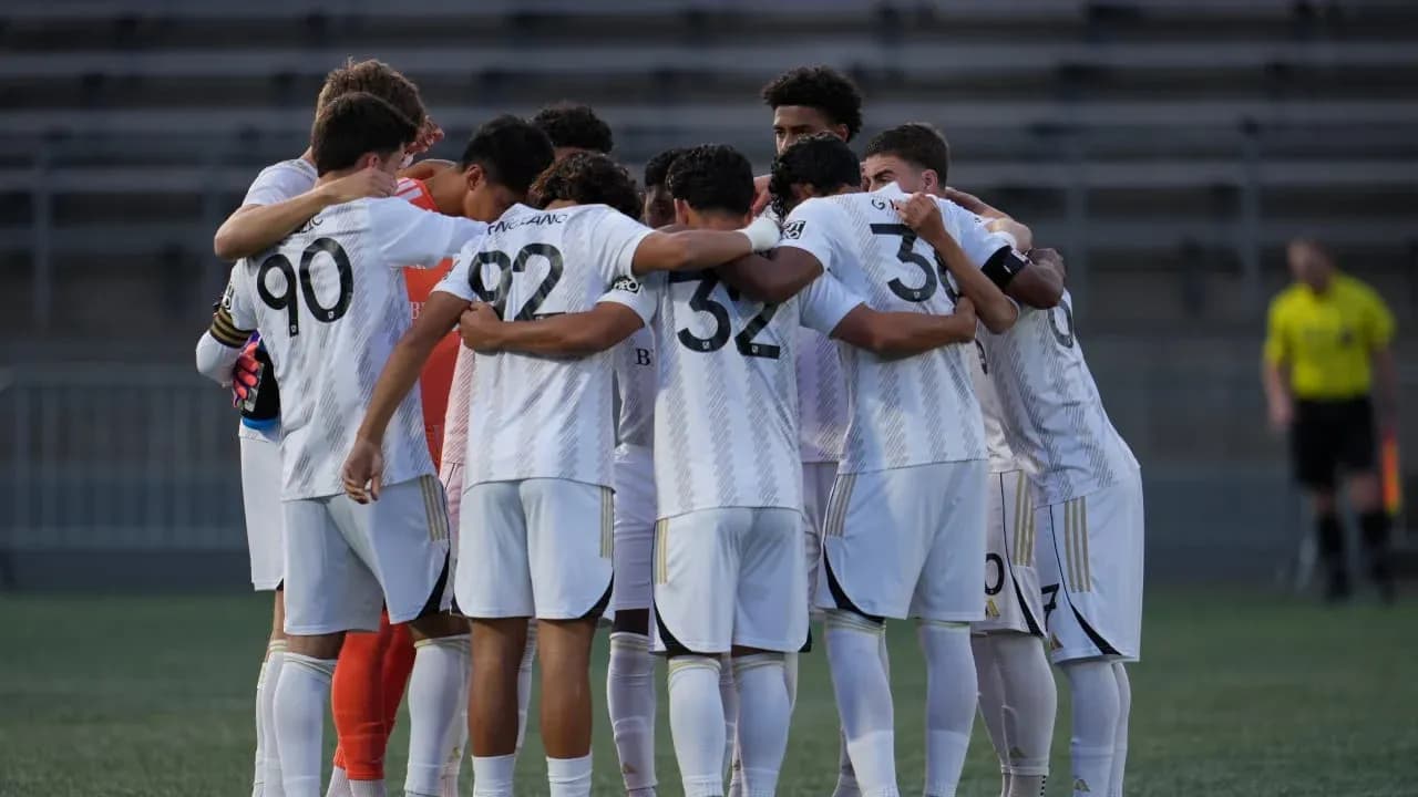 Players huddling before the match