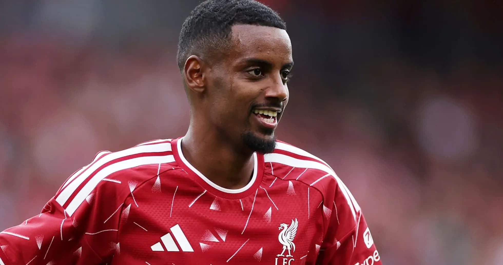 Player smiling in Liverpool FC training kit