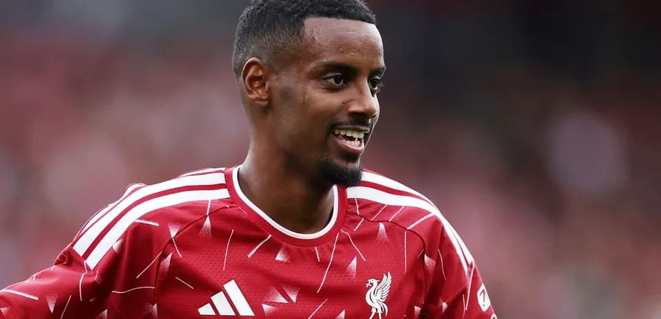 Player smiling in Liverpool FC training kit