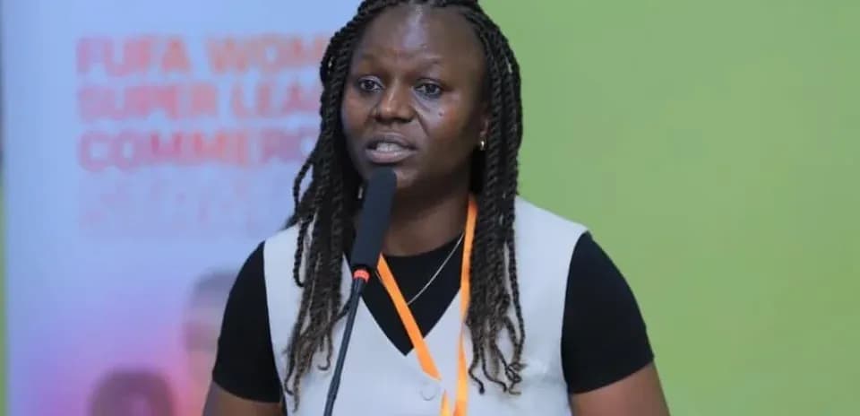 Woman speaking at FUFA Women Super League event