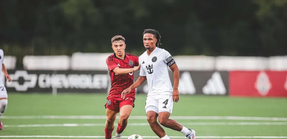 Inter Miami II player dribbling against Toronto II opponent
