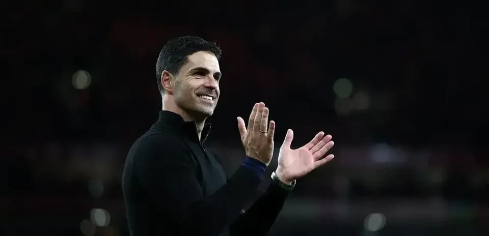 Manager applauding fans after the match