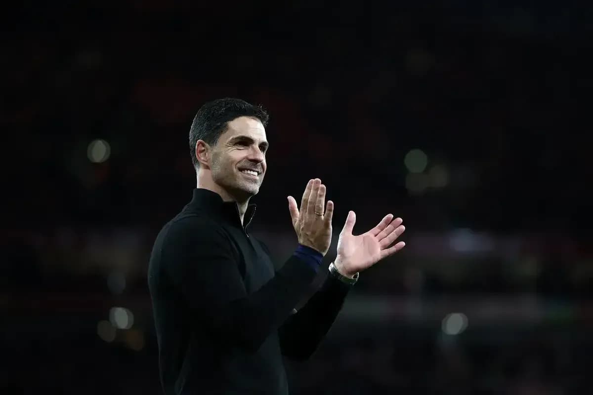 Manager applauding fans after the match