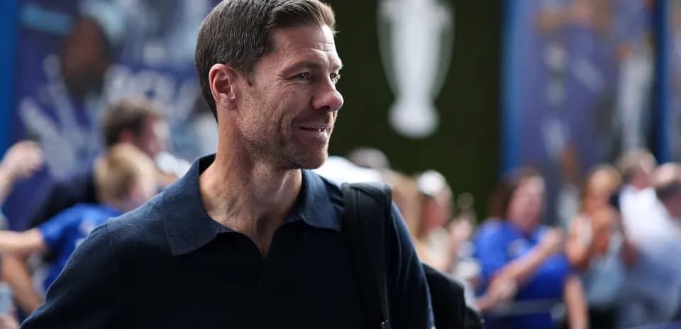 Man in a navy shirt arriving at event