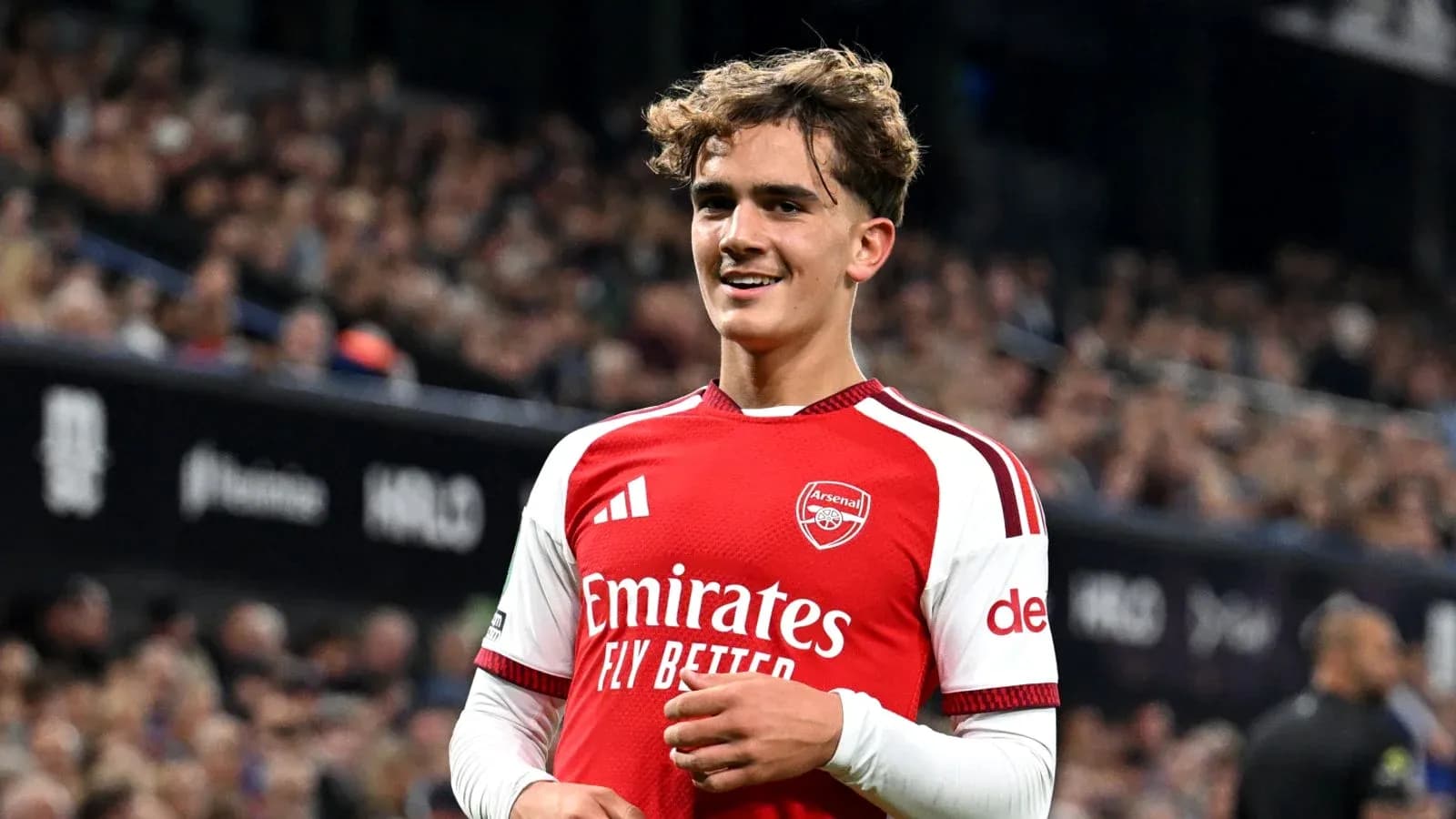 Arsenal player smiling during match celebration