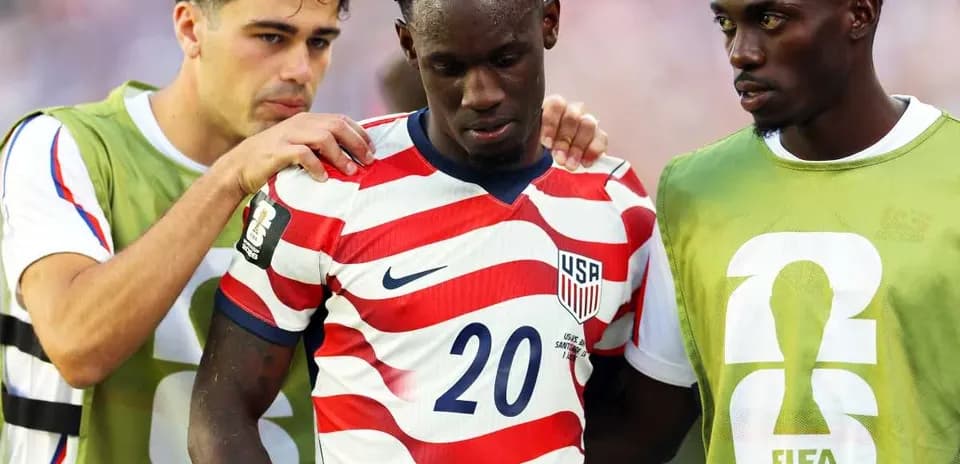 USA players comforting teammate during World Cup match