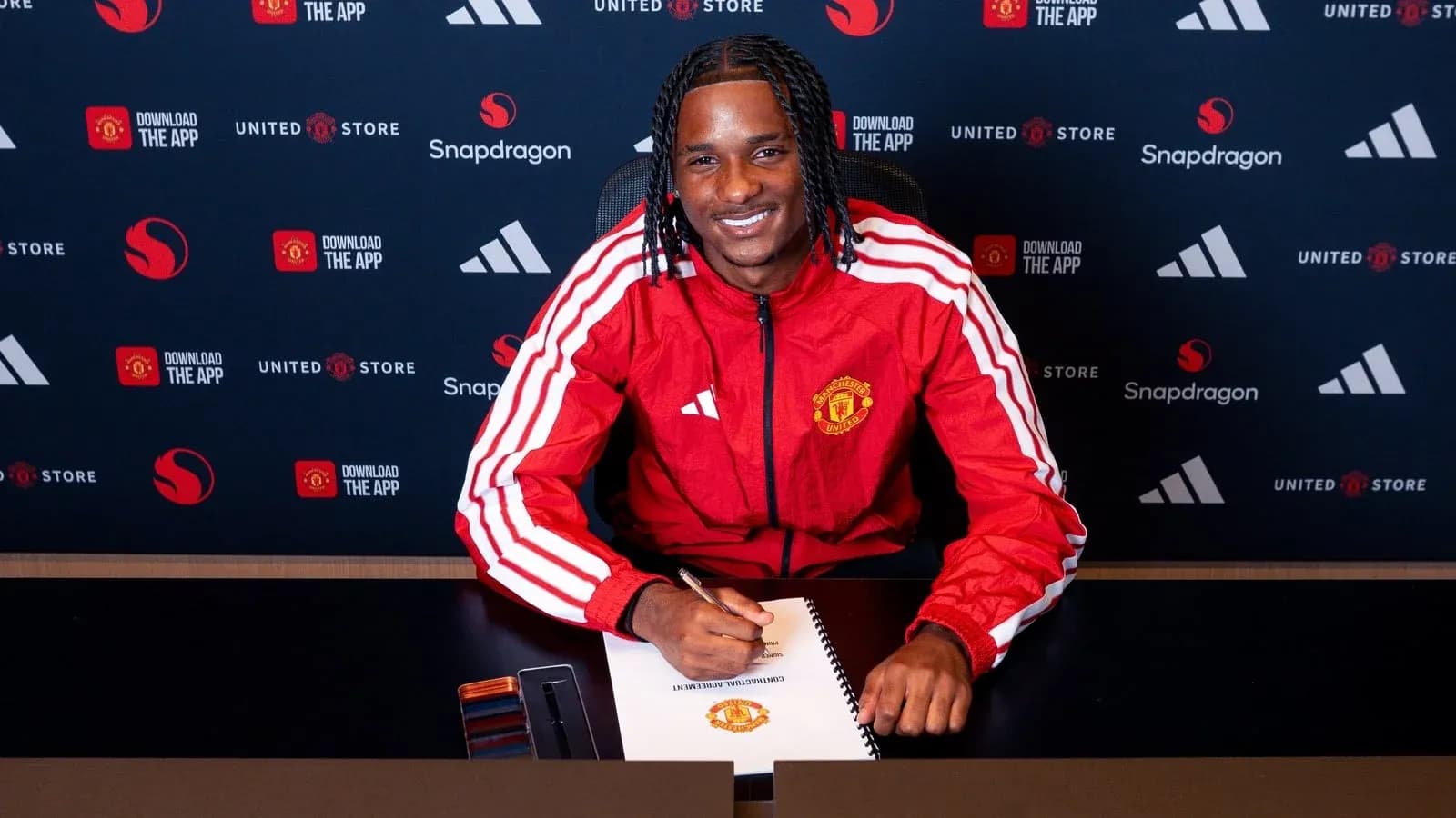 Player signing contract at Manchester United event