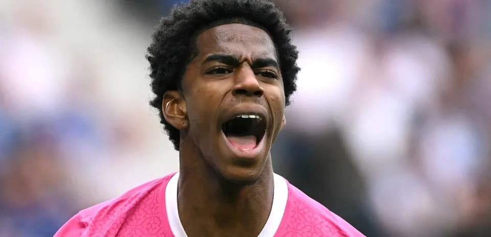 Player shouting while wearing a pink jersey