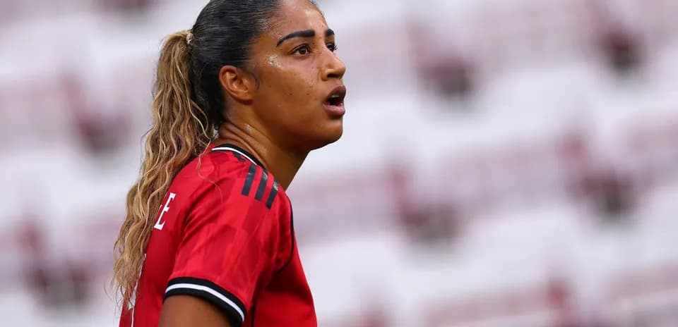 Female player in red jersey during match