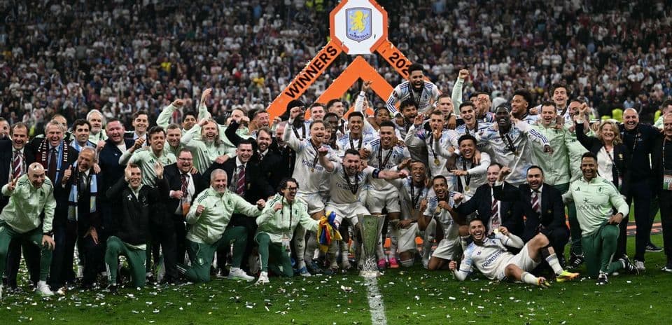 Aston Villa celebrating victory with trophy at Wembley