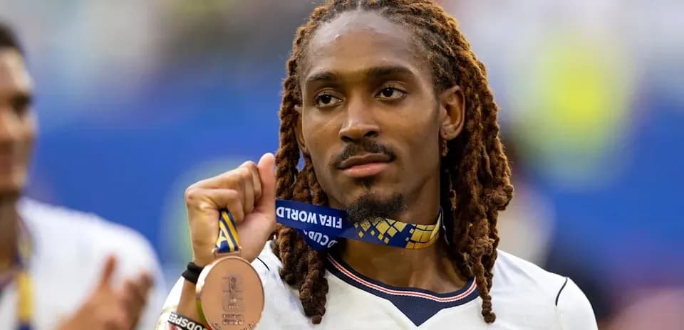 Player holding bronze medal after tournament match