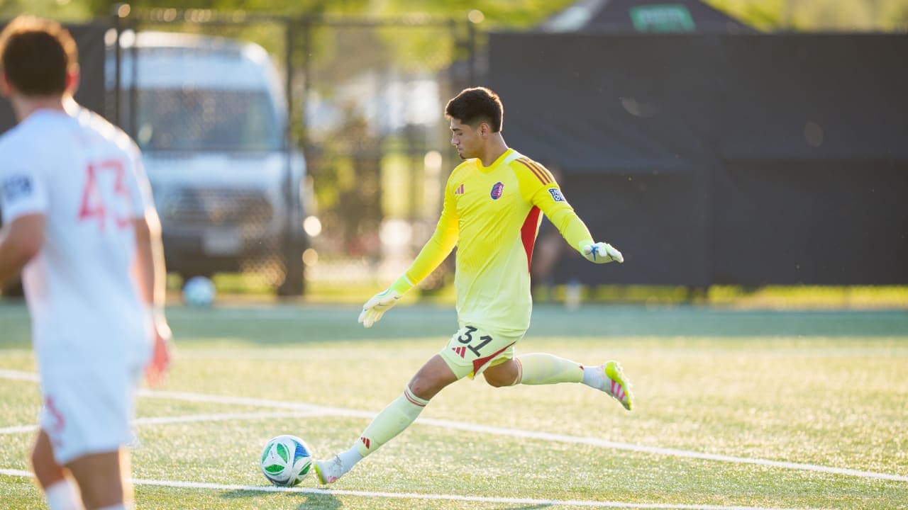 Goalkeeper kicking the ball during match