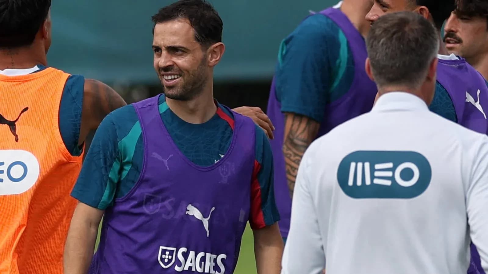 Players interacting during training session on field
