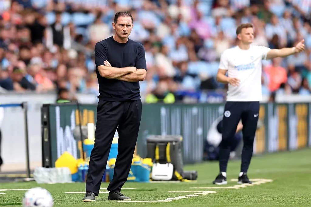 Two coaches on the sidelines during match