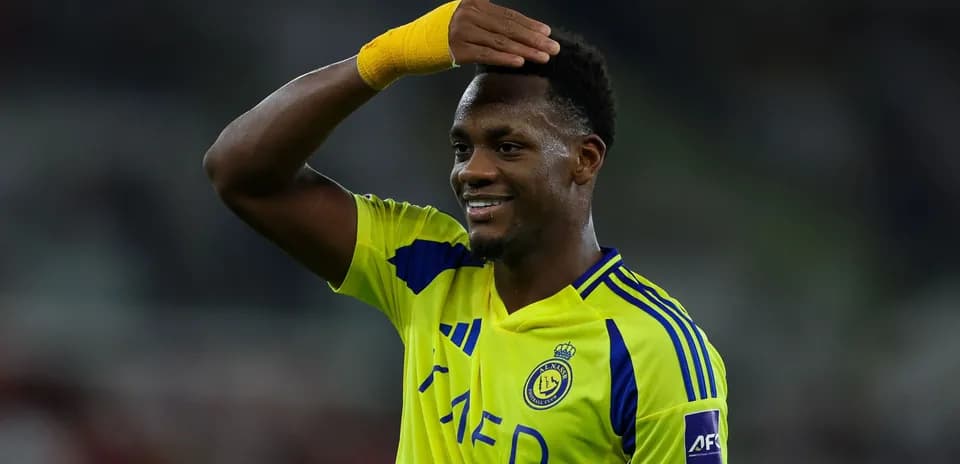 Player celebrating with a hand salute gesture
