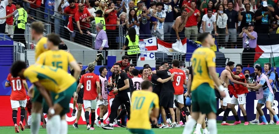 Players celebrating with fans after match victory