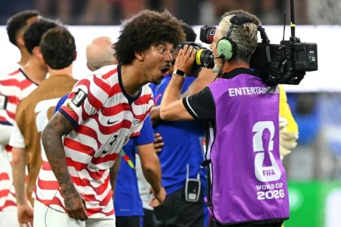 Player celebrating with camera after match