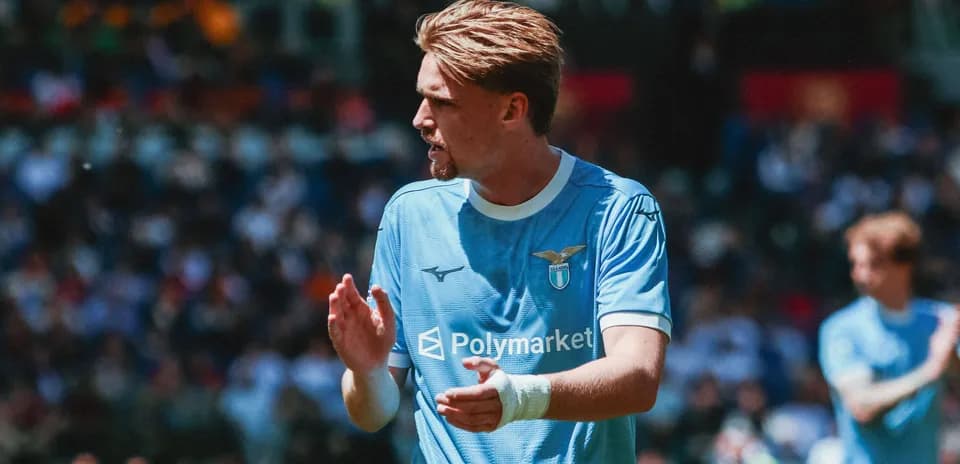 Lazio player clapping during match in blue kit