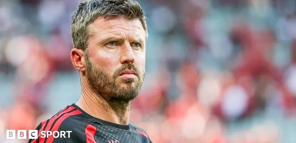 Coach looking focused on the sidelines during match