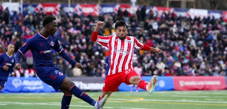 Atlético Ottawa player kicking the ball
