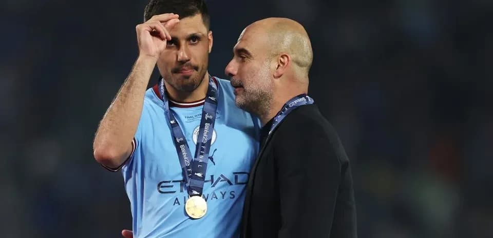 Player and coach discussing after match victory