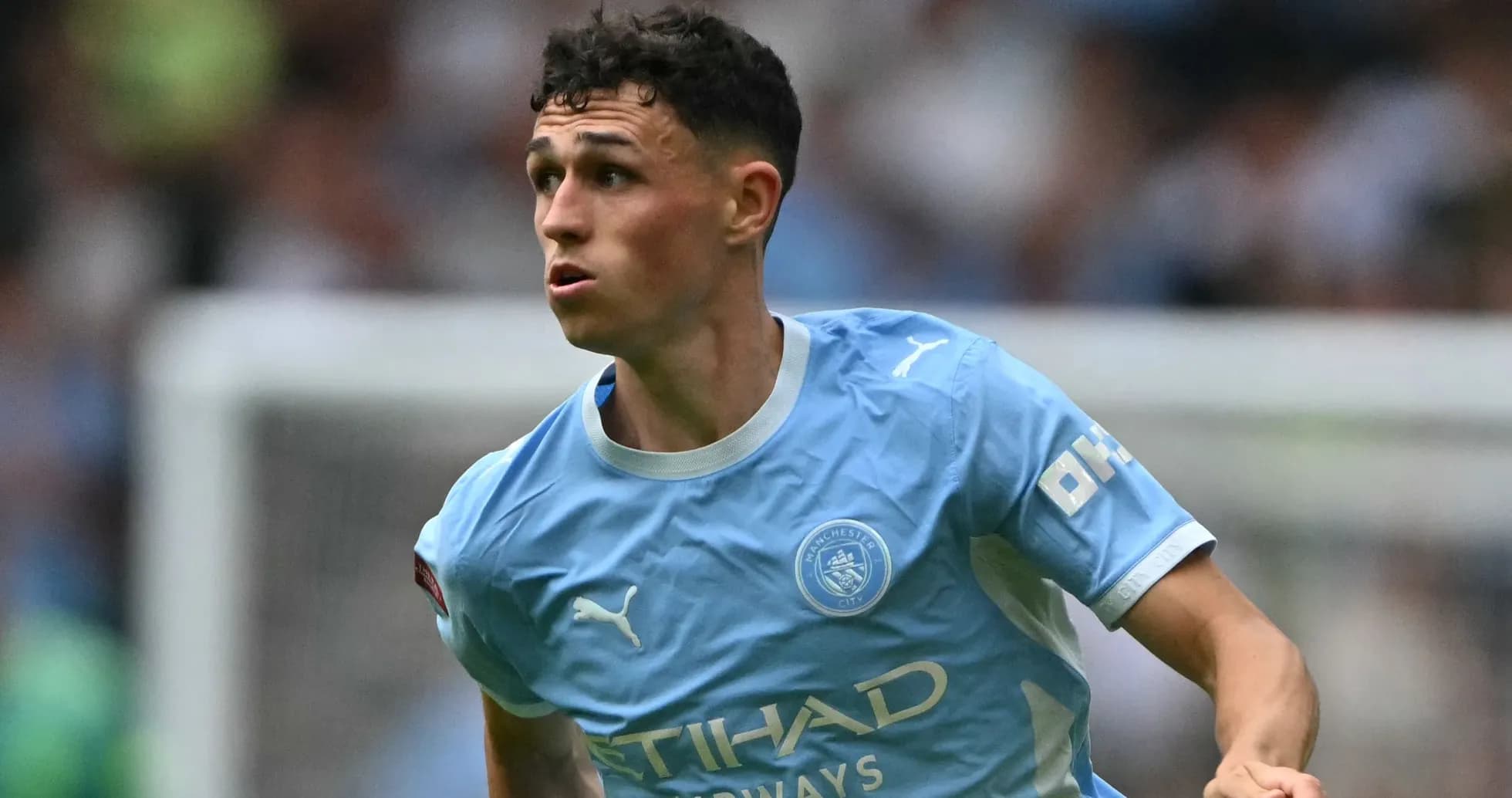 Phil Foden running during Manchester City match