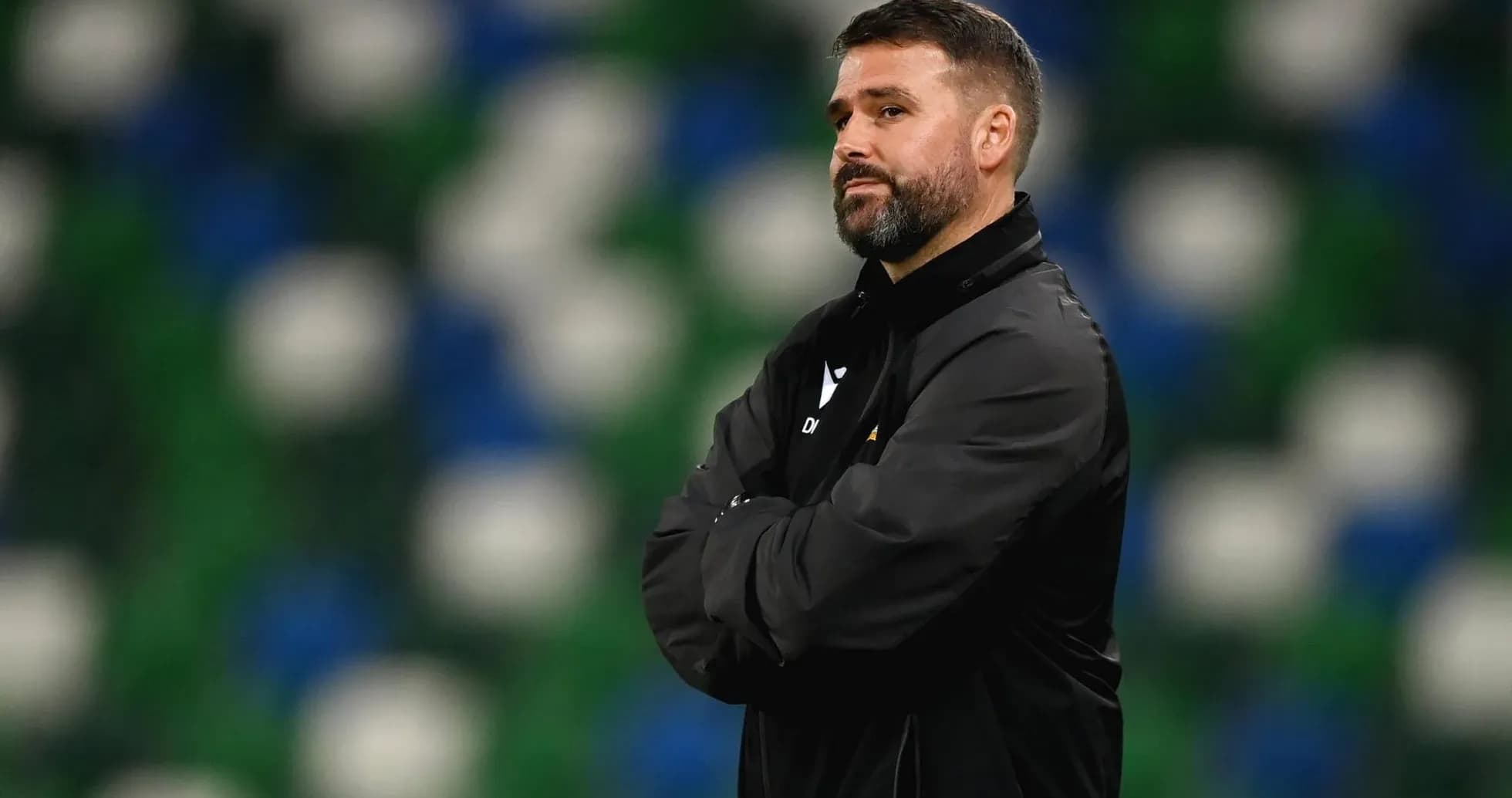 Coach observing the match from the sidelines