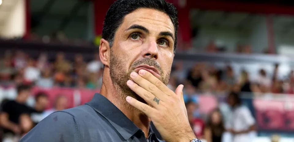 Coach observing the match from the sidelines