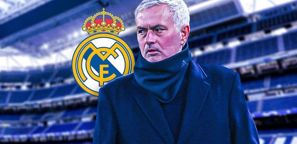 Manager at stadium with Real Madrid logo background