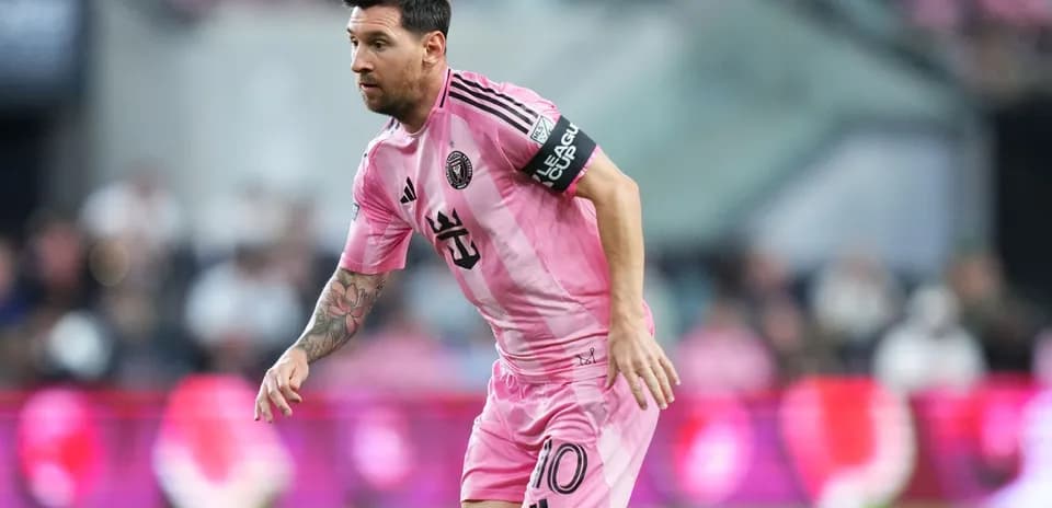 Player in pink jersey running on the field