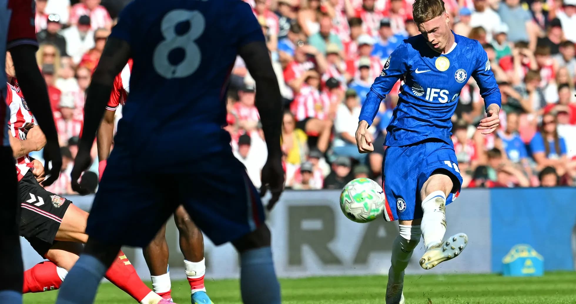Chelsea player taking a shot during match