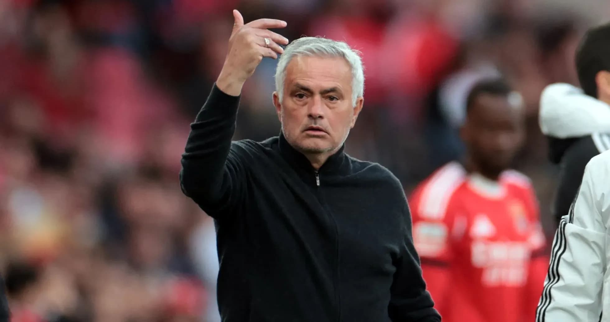 Coach gesturing during a football match on sideline