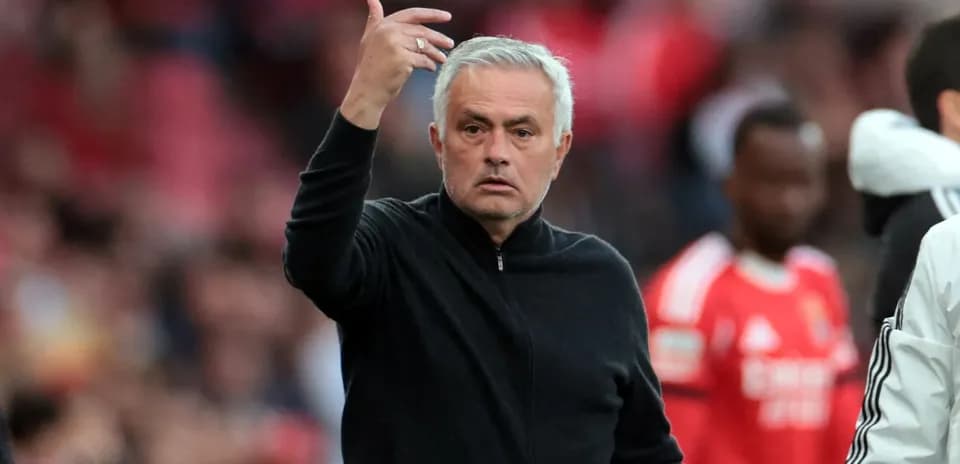 Coach gesturing during a football match on sideline